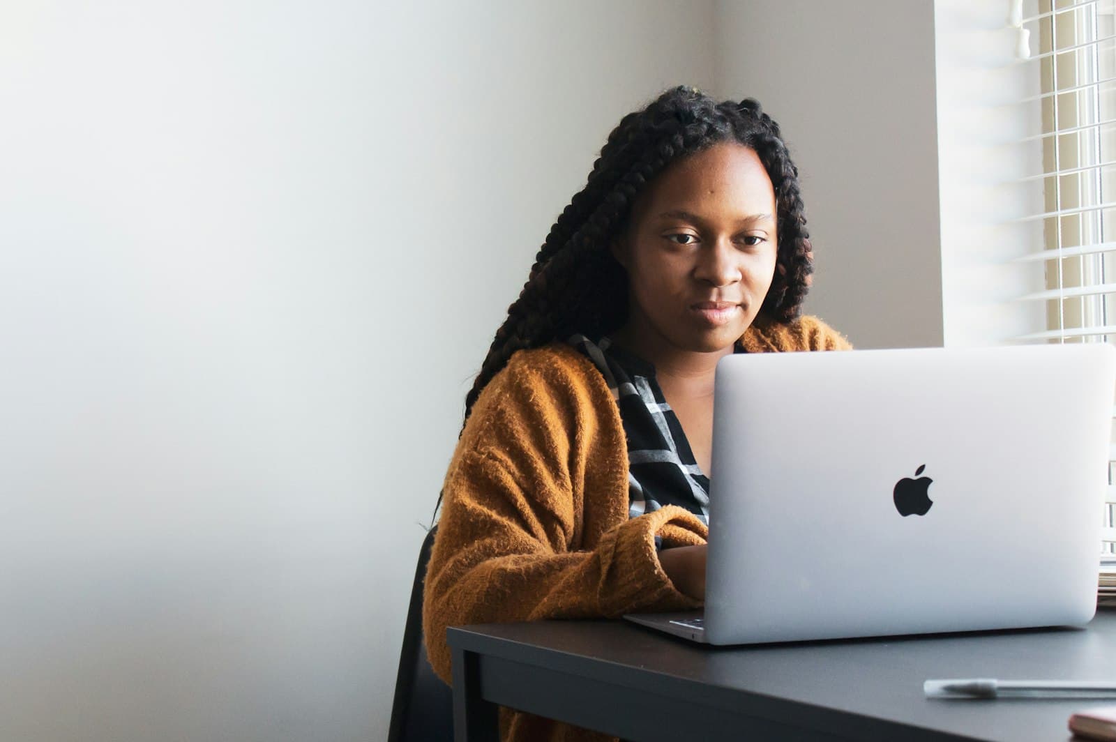 A writer drafting copy on her laptop